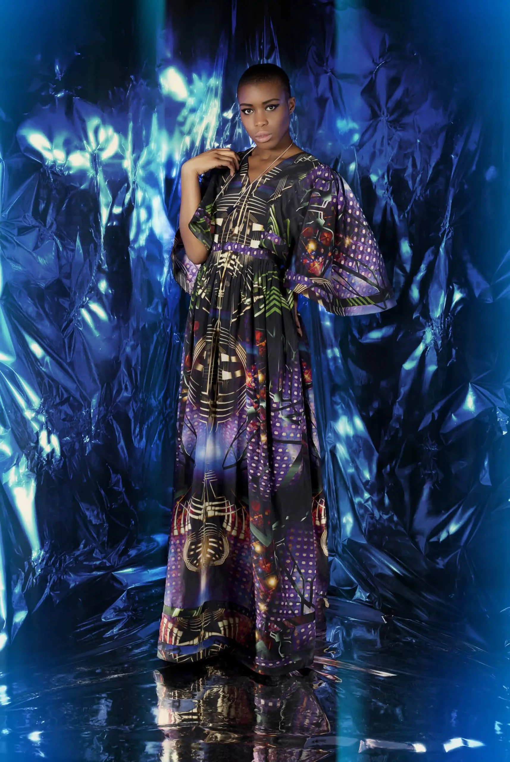 Long silk kimono-style kaftan with slight gathering at the waist, featuring satellite and metallic psychedelic prints.
